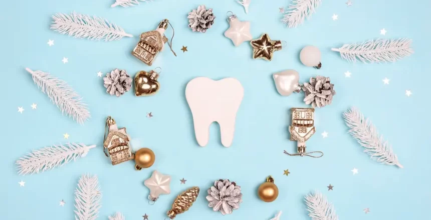 White,Tooth,Surrounded,By,Christmas,Gold,And,White,Decorations,Blue